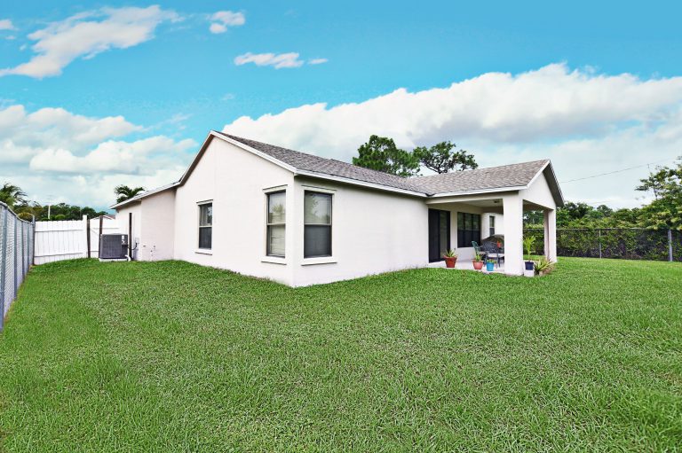 Photo by Mar10Photography, back yard view of property at Port Saint Lucie