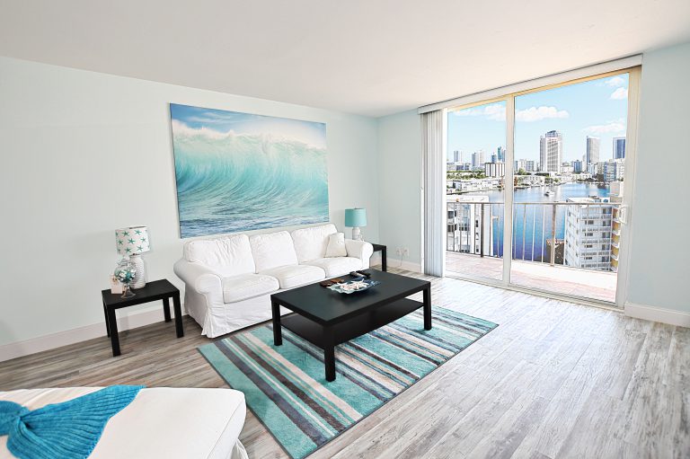 Photo By Mar10Photography of LivingRoom View of PierView and City